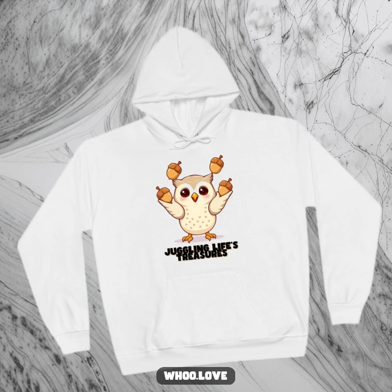 Funny Giddy Owl Hoodie: A comfortable hoodie showcasing a happy owl skillfully juggling shiny acorns, perfect for cozy, fun days.